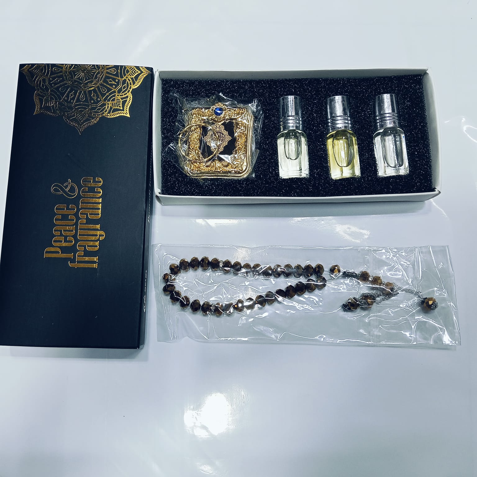 Premium Islamic Gift Combo – Tohuran Non-Alcoholic Attar Set (Classic, Amir-Al-Oud, Rasha, Soft), Crystal Tasbih & World’s Smallest Imported Pocket Mini Quran Sharif Gift Package